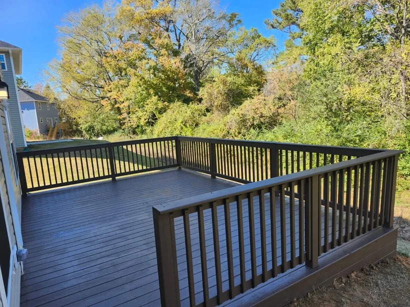 Finished deck and railing looking out over the treeline